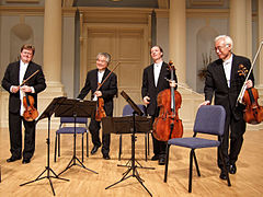 Image 10A modern string quartet. In the 2000s, string quartets from the Classical era are the core of the chamber music literature. From left to right: violin 1, violin 2, cello, viola (from Classical period (music))