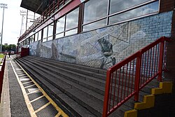 Graffiti artwork by the Nomad Clan along 'The Well' at Sewell Group Craven Park, Kingston upon Hull.