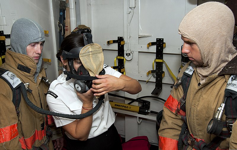 File:U.S. Navy Electronics Technician 3rd Class Zehra Hodzic, center, instructs the Latvian Youth Guard on how to don firefighting gear June 10, 2013, during a tour aboard the U.S. 6th Fleet command ship USS Mount 130610-N-ZL691-040.jpg