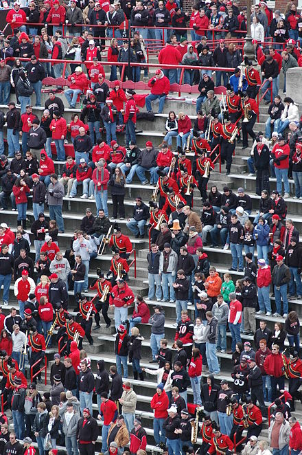 The UC Bearcat Band charges down Nippert Stadium's steps.