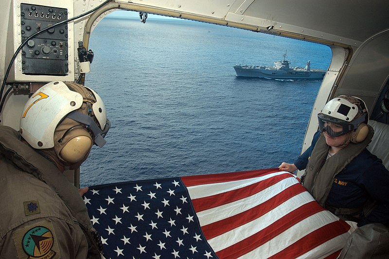 File:US Navy 050614-N-2468S-001 Lt. Col Mike Rezendes, left, and Lt. j.g. Alexandria Myers, displays the American flag while celebrating Flag Day.jpg