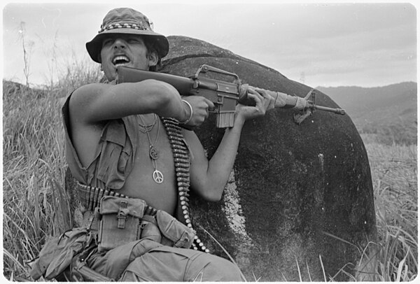 A 4th Battalion, 21st Infantry squad leader shouting instructions after taking sniper fire on a patrol southeast of Chu Lai, 1971