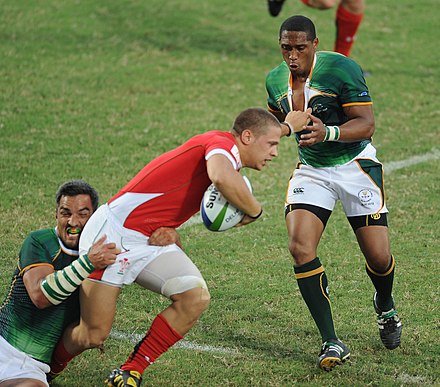 Rugby sevens teams in their Pool B match at the 2010 Commonwealth Games.
