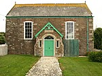 Wheal Busy Chapel and attached walls, gate-piers and railings