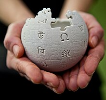 Wikipedia mini globe handheld cropped.jpg