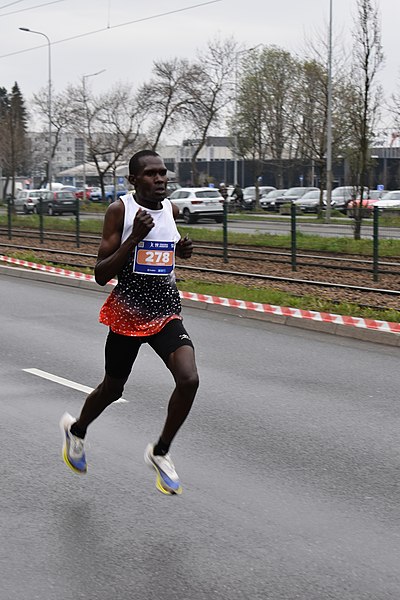 File:19. PZU Cracovia Marathon 2022, David Metto (Kenya) winner, John Paul II Av (30 km), Nowa Huta, Krakow, Poland.JPG