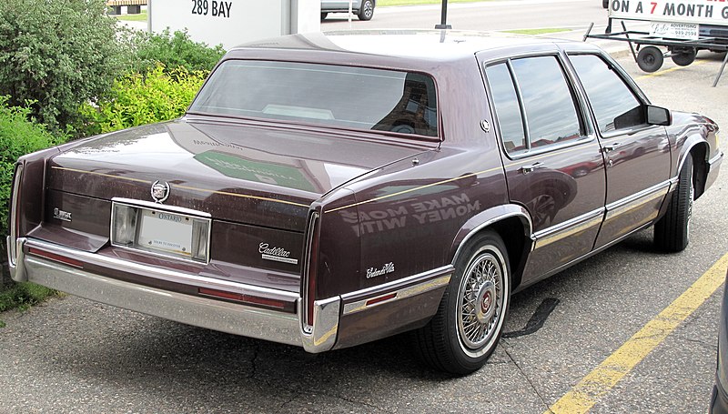 File:1992 Cadillac Sedan DeVille in Royal Maroon, Rear Right, 06-17-2022.jpg