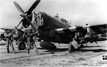 Ground personnel of the 358th Fighter Group prepare to start the engine of a P-47 Thunderbolt nicknamed "Chunky". 358th Fighter Group P-47D Starting.jpg