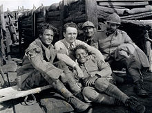 Director Frank Borzage (center) on the battlefield set of 7th Heaven with cast members (from left) Charles Farrell, George E. Stone (reclining), Émile Chautard and David Butler (1927)