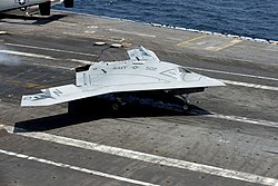 10 July 2013: the Northrop Grumman X-47B (photographed above) becomes the first robotic aircraft to successfully land on an aircraft carrier at sea. A U.S. Navy X-47B Unmanned Combat Air System makes an arrested landing aboard the aircraft carrier USS George H.W. Bush (CVN 77) as the ship conducts flight operations in the Atlantic Ocean off the coast of Vir 130710-N-LE576-002.jpg