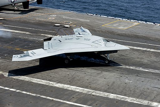 A U.S. Navy X-47B Unmanned Combat Air System makes an arrested landing aboard the aircraft carrier USS George H.W. Bush (CVN 77) as the ship conducts flight operations in the Atlantic Ocean off the coast of Vir 130710-N-LE576-002