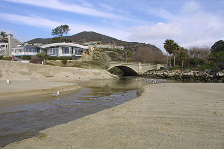 Aliso Creek empties into a sandy lagoon at its mouth in Laguna Beach. Due to tides and erosion, its mouth is ever-changing.