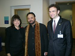 Alston Koch is with British Minister of State Barbara Follett. Alston Koch with British Minister of State Barbara Follett and Adviser to the U.S. President George Allan.jpg