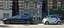 Two electric cars charging on street in Amsterdam: Tesla Model S (left) and Smart ED (right). Amsterdam 06 2015 1616 (2).JPG