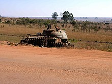 The remnants of a tank in the Angolan countryside, destroyed by a landmine. Angola - zaminovany pozustatek obcanske valky.jpg