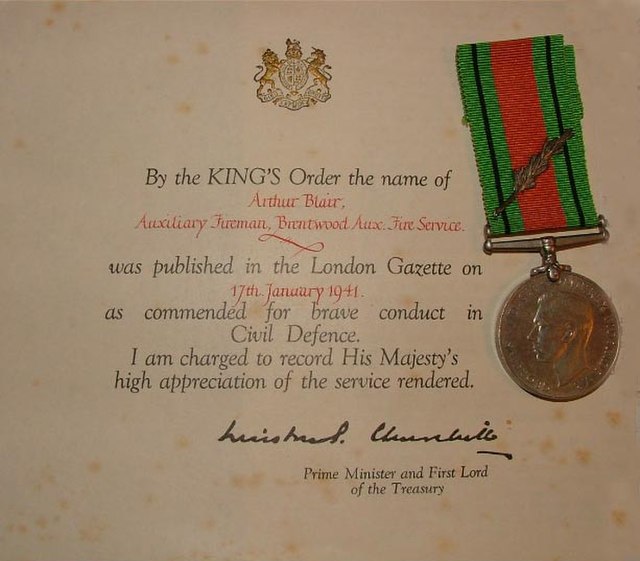 A firefighters 1941 certificate and Defence Medal with Laurel leaf