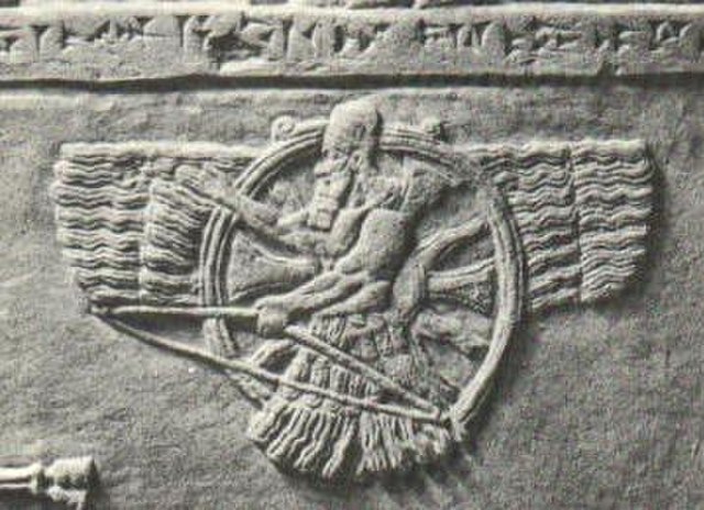 Feather robed and turbaned archer figure of Ashur (a later development of Enlil) superimposed on a sun disc