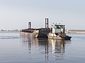 * Nomination Dredging activities on the Langwarder Wheels. Motor Tug Leander moved Empty mud barge. --Famberhorst 06:28, 25 March 2018 (UTC) * Promotion Good quality. --Poco a poco 06:31, 25 March 2018 (UTC)
