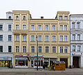 Apartment building with shops in a closed area