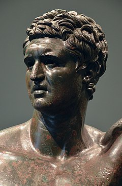 Male head of a bronze statue