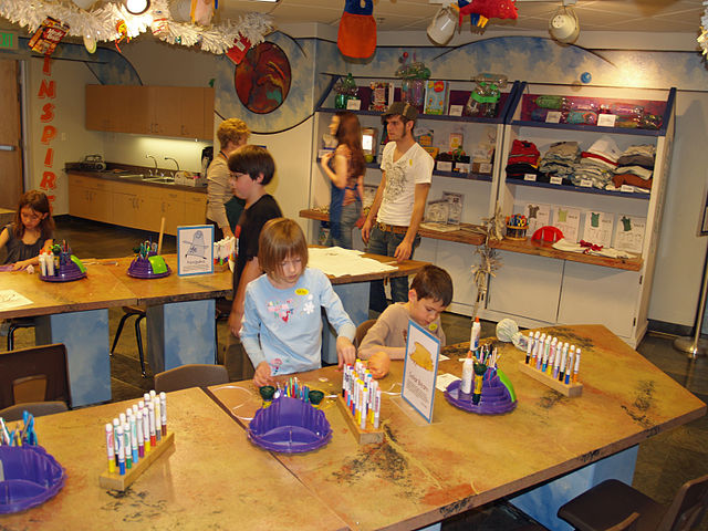 At the Buell Children's Museum in Pueblo, Colorado, children and their guardians partake in "arts and crafts" (i.e. handicrafts)