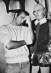 Reynolds (left) with John Williams as William Shakespeare in The Twilight Zone featuring Reynolds parodying look-alike Marlon Brando Burt Reynolds John Williams The Bard Twilight Zone 1963.jpg