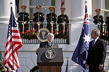 Australian prime minister John Howard responds to George W. Bush's welcoming remarks during an official visit in 2006. Bush-Howard 2006 speech.jpg