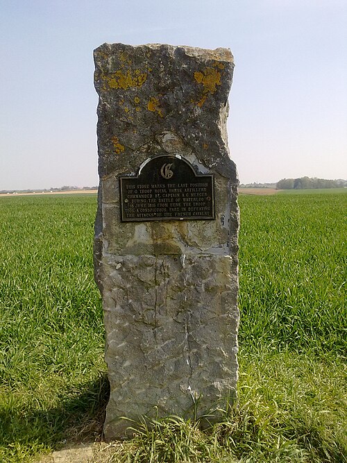 Memorial stone marking the position where Mercer's troop fought French cavalry on the Waterloo battlefield.