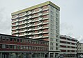 English: One of the high-rise buildings at Danmarks plass in Bergen, Norway, built in the 1960s. The four buildings are being renovated; when this picture was taken, this was the only of the buildings with the original facade still intact.