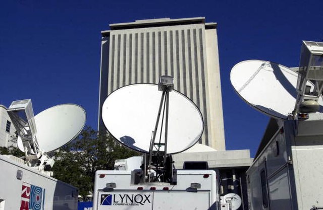 Close-up view of satellite trucks parked by the Florida State Capitol during the 2000 presidential election vote dispute