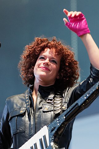 <span class="mw-page-title-main">Régine Chassagne</span> Canadian singer, songwriter, musician, multi-instrumentalist