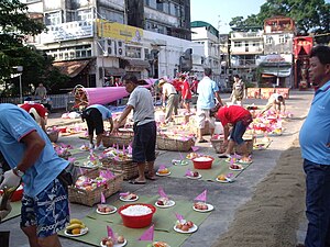 Offerings are prepared for hungry ghosts during Ghost month in Hong Kong. Ghost Festival in Ping Chou.JPG