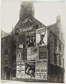 A Camp Coffee poster among other advertisements on a tenement building in 1929 Gifford Park No. 2A - 2 Ref. 161. Area W. (4617888255).jpg