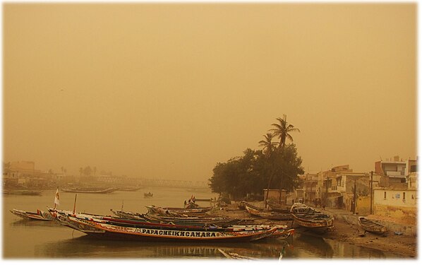 Harmattan dust obscures the harbor at St. Louis, Senegal, a few miles from the Mauritanian southern border. This sort of weather is common in December.