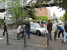 Hollyoaks commonly filmed scenes in the Groves (pictured) in Chester, until it became too expensive to move operations from Liverpool to Chester. Hollyoaks Filming 990916.jpg