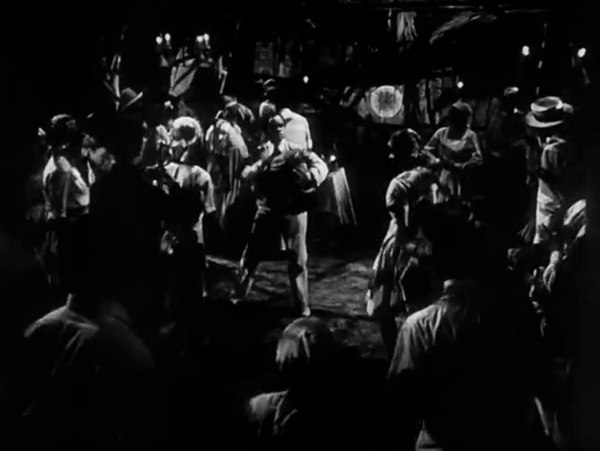 A scene taking place in a houmfort, or Haitian Vodou temple