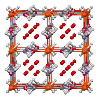 The unit cell of Prussian blue determined by neutron diffraction,[29] with crystallographically disordered water molecules both in cyanide ion positions and in the void space of the framework. Again, one fourth of the Fe(CN)6 groups shown will be missing. This illustration superimposes both possibilities at each site — water molecules or cyanide ions.