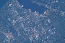 The city on July 2, 2022; the county airport is in the bottom left hand corner. Taken from the International Space Station with north oriented towards the upper right.