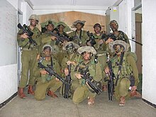 Israeli "Netzah Yehuda" recon company in full combat gear prepare for a night raid in the West Bank Israeli Urban combat.jpg