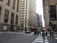 The intersection of Jackson Blvd and LaSalle Street in Chicago, Illinois, was used to film the empty parade route scene seen in the crossover. Jackson Blvd and LaSalle Street, Chicago, Illinois (9179352329).jpg
