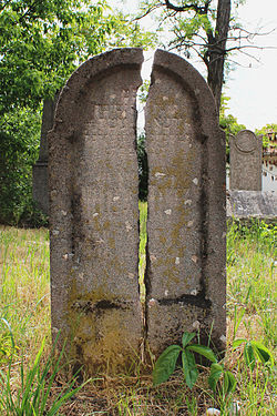 Broken gravestone in the old Rákoskeresztúr Jewish cemetery, Budapest, Hungary