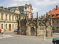 The Stone Fountain from 1495, St John Nepomuk Church in the background