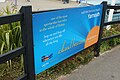 A large promotional sign at Alum Bay for the Needles Tour.