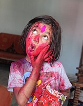 Little girl playing Holi with gulaal Little girl playing Holi with gulaal.jpg