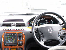 An early model UK-spec (right hand drive) W220 S-Class, with the COMAND system screen and buttons on the center console. Mercedes W220 interior view.JPG