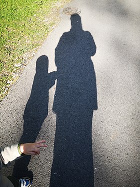 Mum & almost 2 y.o child in shadows