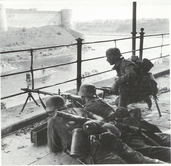 German soldiers defending the western bank of the Narva River, with the fortress of Ivangorod on the eastern side