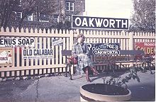 Oakworth railway station sign and vintage advertising boards Oakworth Railway Station 1981.jpg