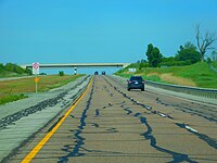 Signs for an emergency crossover in the median of a motorway in Canada: highway=service service=emergency_access access=no emergency=designated