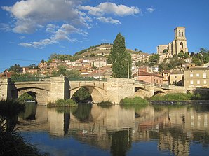 Pampliega - town view with the bridge over the Río Arlanzón and the church of San Pedro